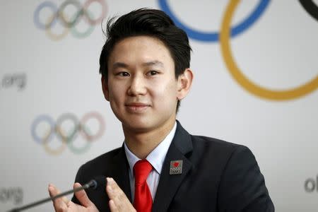 FILE PHOTO: Denis Ten of Kazakhstan, bronze medalist in men's singles figure skating of the 2014 Winter Olympics in Sochi, attends a news conference after the briefing for International Olympic Committee (IOC) members by the 2022 Winter Olympic Games candidate city of Almaty at the Olympic Museum in Lausanne, Switzerland, June 9, 2015. REUTERS/Pierre Albouy/File Photo