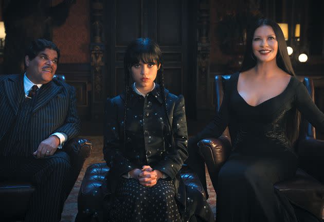 Luis Guzmán as Gomez Addams, Jenna Ortega as Wednesday Addams and Catherine Zeta-Jones as Morticia Adams in Netflix's 