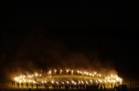 <p>Members of the Ku Klux Klan participate in a “lighting” after a “white pride” rally in rural Paulding County near Cedar Town, Ga., April 23, 2016. (Photo: Mike Stewart/AP) </p>