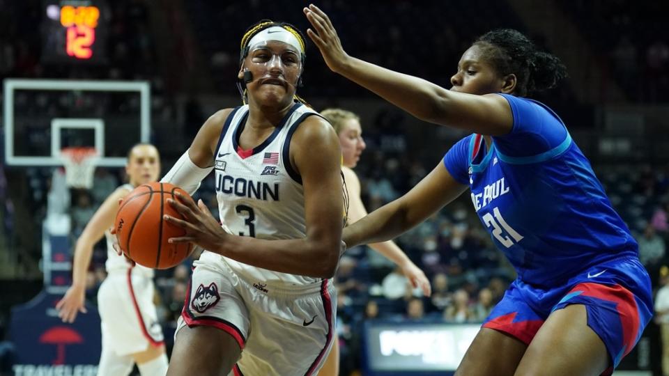 Jan 23, 2023; Storrs, Connecticut, US; UConn Huskies forward Aaliyah Edwards (3) drives the ball against DePaul Blue Demons guard Darrione Rogers (21) in the first half at Harry A. Gampel Pavilion.