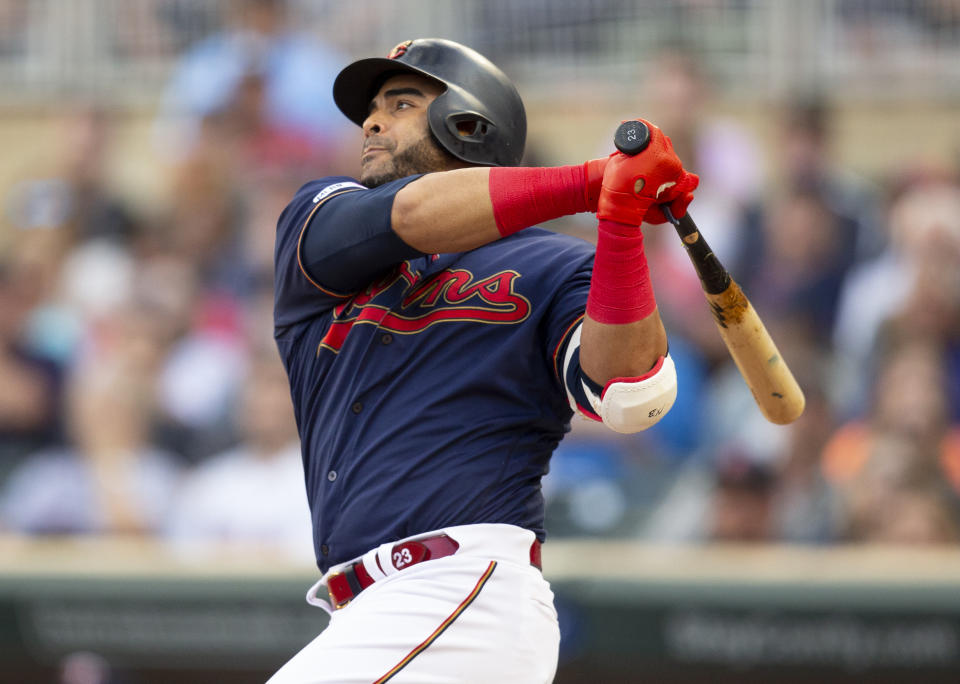 Minnesota Twins' Nelson Cruz hits a double against the Boson Red Sox in the first inning of a baseball game Monday, June 17, 2019, in Minneapolis. (AP Photo/Andy Clayton- King)