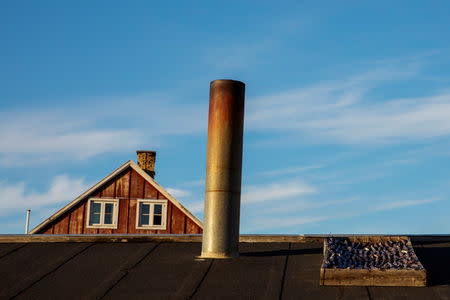 Fish dry on a rooftop in the late night sunshine in the town of Tasiilaq, Greenland, June 17, 2018. REUTERS/Lucas Jackson