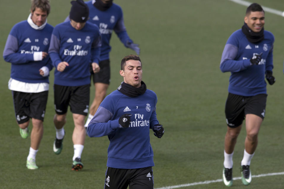 Real Madrid's Cristiano Ronaldo runs with teammates during a training session in Madrid, Spain, Friday Jan. 20, 2017. Real Madrid will play Malaga Saturday in a Spanish La Liga soccer match after having lost their last two games. (AP Photo/Paul White)