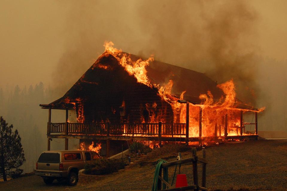 In this photo provided by the Madison County Disaster & Emergency Services, a cabin explodes in flames at the 19 mile fire, Thursday, Aug. 30, 2012 between Madison County and Butte, Mont. Rapidly expanding wildfires across a broad swath of southern Montana have caused injuries and burned homes, buildings and vehicles, authorities said Thursday, as firefighters struggled to contain the flames amid hazardous conditions. (AP Photo/Madison County Disaster & Emergency Services, Steve DiGiovanna)