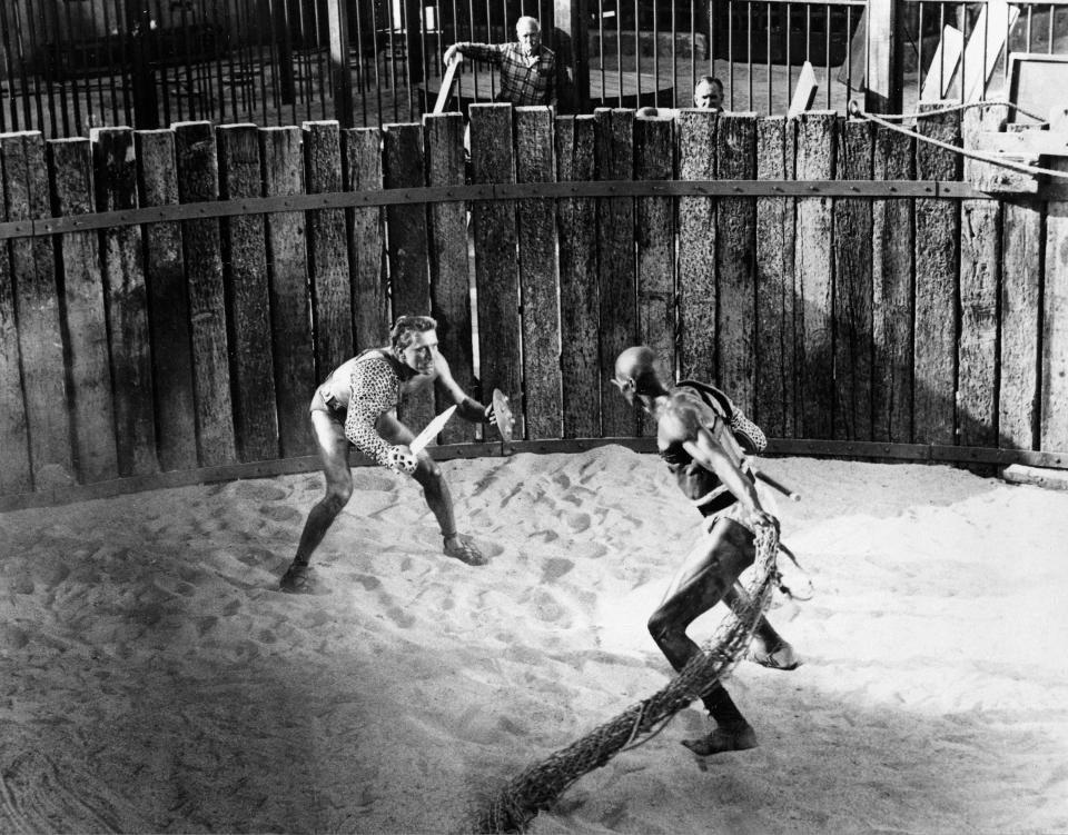 Roman slave and gladiator Spartacus (Kirk Douglas, left) battles Draba (Woody Strode) in a scene from "Spartacus."