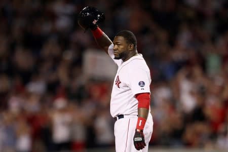 FILE PHOTO: Boston Red Sox's Ortiz stands safe at second base and salutes crowd after hitting 2000th career hit against Detroit Tigers during MLB American League Baseball game in Boston