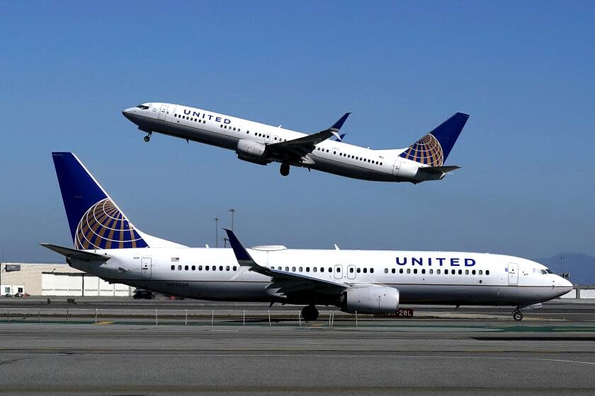 FILE - In this Oct. 15, 2020, file photo, a United Airlines airplane takes off over a plane on the runway at San Francisco International Airport in San Francisco. United Airlines says it's investing in a startup that hopes to build small electric-powered planes that might be flying in a few years. United made the announcement Tuesday, July 13, 2021, but didn't say how much it's investing in Sweden-based Heart Aerospace. (AP Photo/Jeff Chiu, File)