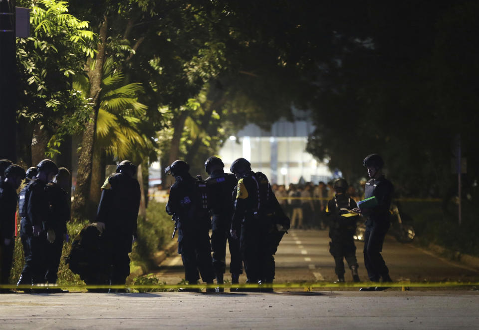 Officers stand guard at the site where an explosion that police said came from a firecracker, near the venue of the presidential candidates debate in Jakarta, Indonesia, Sunday, Feb. 17, 2019. Indonesia is gearing up to hold its presidential election on April 17 that will pit in the incumbent against the former general.(AP Photo / Achmad Ibrahim)