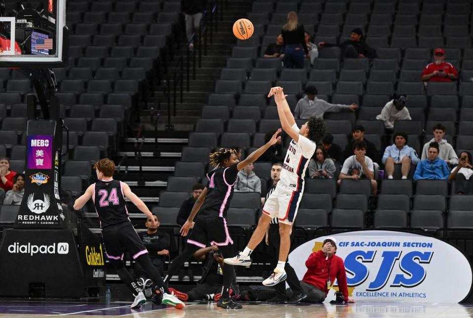 Modesto Christian’s Myles Jones hits a jump shot over Lincoln’s Zeke Davis during the Sac-Joaquin Section Division I championship game at the Golden 1 Center in Sacramento, Calif., Wednesday, Feb. 21, 2024. Jones had 17-points in the game.