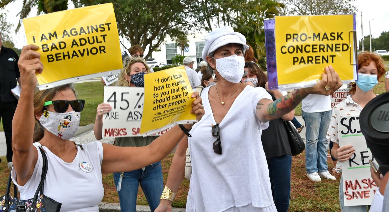 Protesters both in favor of and opposing the Sarasota County School Board's mask policy gathered outside the Sarasota County School Board building, in Sarasota, in October 2020.