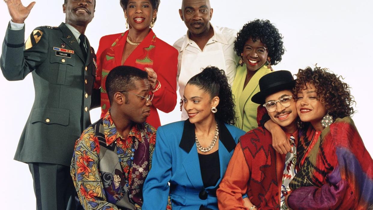 <div>A DIFFERENT WORLD -- Pictured: (back row, l-r) Glynn Turman as Col. Bradford 'Brad' Taylor, Dawnn Lewis as Jaleesa Vinson Taylor, Lou Myers as Vernon GAines, Charnele Brown as Kimberly 'Kim' Reese (front row) Kadeem Hardison as Dwayne Cleophus Wayne, Jasmine Guy as Whitley Marion Gilbert Wayne, Darryl M. Bell as Ronald 'Ron' Johnson, Cree Summer as Winifred 'Freddie' Brooks -- Photo by: NBCU Photo Bank</div>