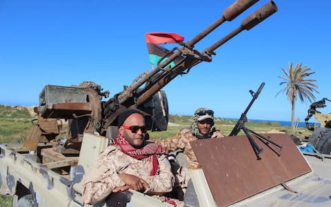 Vehicles and militants, reportedly from the Misrata militia, gather to join Tripoli forces, in Tripoli - Credit: STRINGER/EPA-EFE/REX