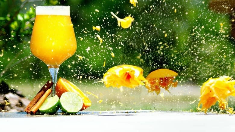 Orange cocktail in wine glass