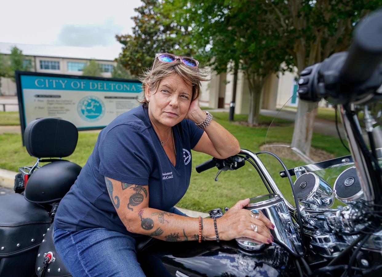 Deltona City Commissioner Dana McCool sits on her motorcycle Tuesday, April 25, in front of City Hall where Volusia Sheriff Mike Chitwood will shave her head on Monday before the commission meeting. McCool, who has bone cancer, said if she was going to lose her hair during treatment, she wanted to find a way to help others.