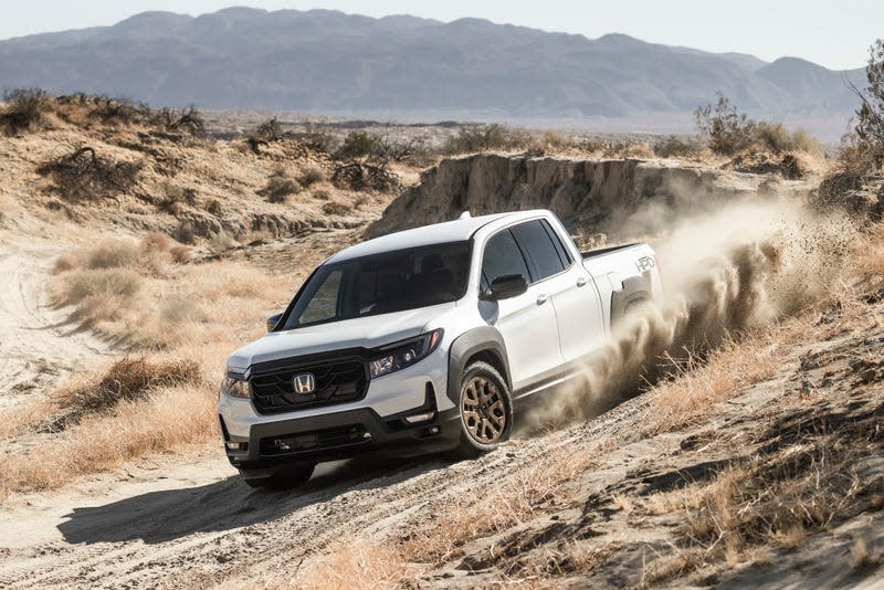 Honda Ridgeline pickup truck driving offroad