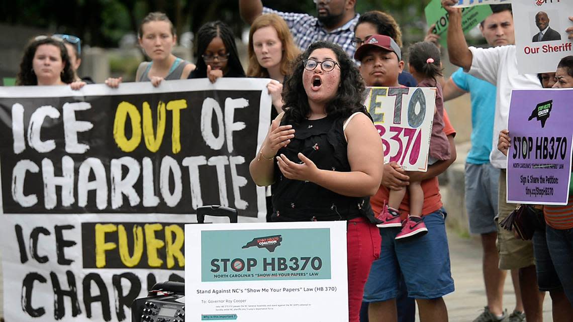 Stefania Arteaga, with immigrant rights group Comunidad Colectiva, speaks to the crowd during an immigration rally at Marshall Park on Wednesday, June 26, 2019. The group sponsored a rally to protest against HB370, which would force sheriffs to cooperate with Immigration and Customs Enforcement.