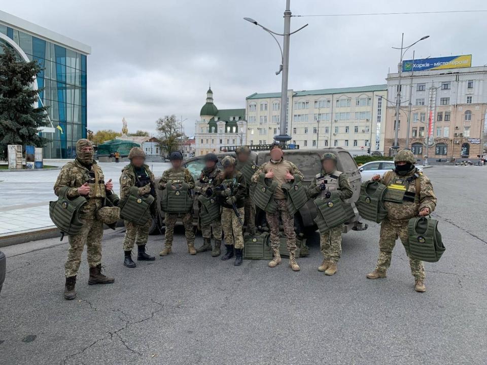 Ukrainian troops posing with Harri of Ukraine Aid Ops in Kharkiv.