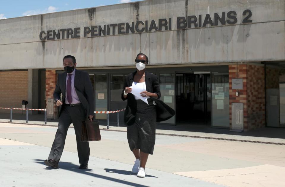 <div class="inline-image__caption"><p>Janice McAfee, widow of John McAfee, flanked by her lawyer Javier Villalba, leaves the prison where her husband was found dead.</p></div> <div class="inline-image__credit">Albert Gea/Reuters</div>