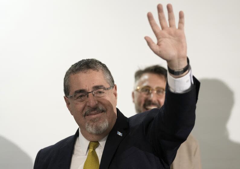 Presidential candidate Bernardo Arevalo speaks waves after preliminary results showed him the victor in a presidential run-off election in Guatemala City, Sunday, Aug. 20, 2023. (AP Photo/Moises Castillo)