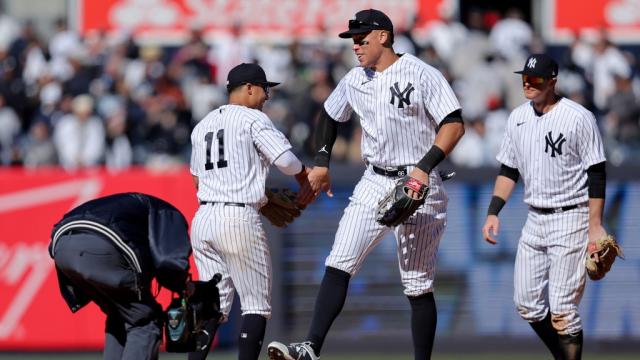 Mar 30, 2023; Bronx, New York, USA; New York Yankees shortstop Anthony Volpe (11) celebrates with center fielder Aaron Judge (99) after defeating the San Francisco Giants at Yankee Stadium.