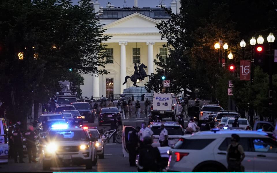 A large law enforcement response is seen near the White House after a protest was dispersed - Getty