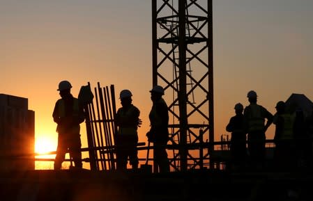 FILE PHOTO: Workers are seen at a construction site in Sandton outside Johannesburg