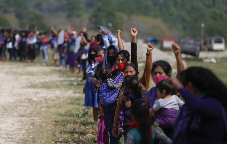 Members of the Zapatista Army of National Liberation, EZLN, shout a farewell to a delegation that will leave for Europe on May 3, in the community of Morelia, Chiapas state, Mexico, Monday, April 26, 2021. The rebels say they are planning to take canoes on a trip to ‘invade’ Spain in May and June, as Mexico marks the anniversary of the 1519-1521 Spanish Conquest of Mexico. (AP Photo/Eduardo Verdugo)