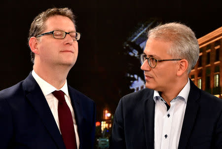 Greens party top candidate and Minister of Economics, Energy, Transport and Regional Development of Hesse Tarek Al-Wazir and Social Democratic Party (SPD) top candidate Thorsten Schaefer Guembel take part in an interview at a TV studio following the Hesse state election in Wiesbaden, Germany, October 28, 2018. Oliver Dietze/Pool via Reuters