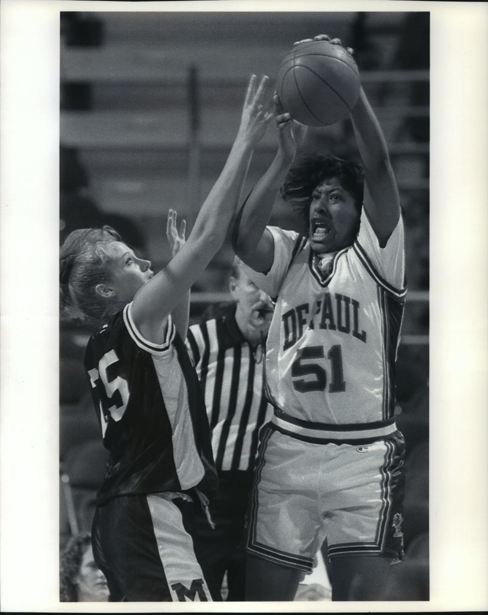 Tough job: Clare Barnard (left) of Marquette depends against Latasha Byears of De Paul in 1995.