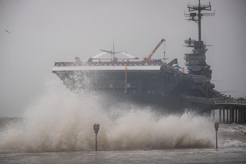 The U.S.S. Lexington weathers Tropical Storm Harold on North Beach, Tuesday, Aug. 22, 2023, in Corpus Christi, Texas.