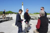 Chairman of the Joint Chiefs of Staff, US Marine Corps General Joseph Dunford (C in red shirt), speaks to reporters on Wake Island on February 2, 2018