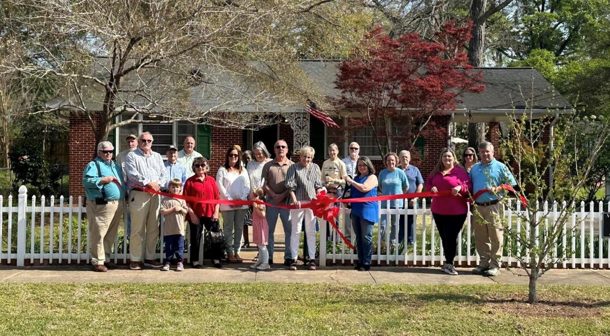 Jefferson County Chamber of Commerce members recently held a ribbon cutting for the Mulberry Street Cottage in Louisville.