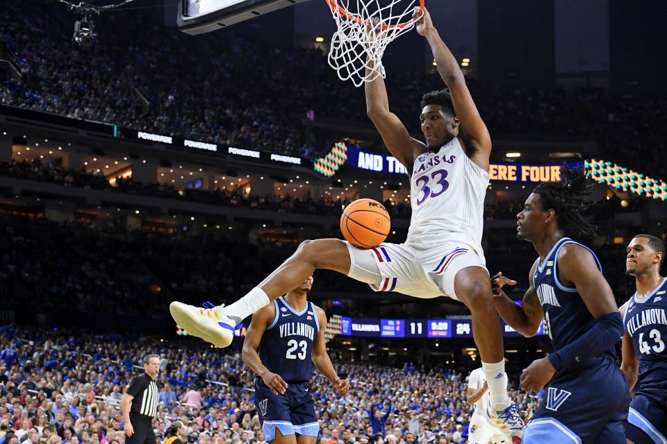 Kansas forward David McCormack dunks against Villanova during the first half in a national semifinal at Caesars Superdome.