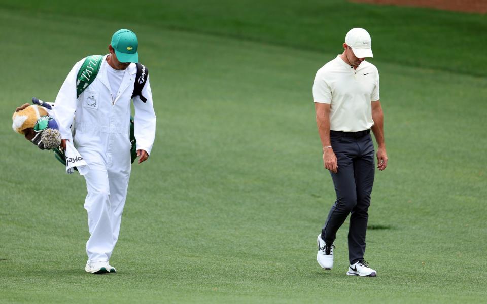 Rory McIlroy of Northern Ireland and his caddie, Harry Diamond,