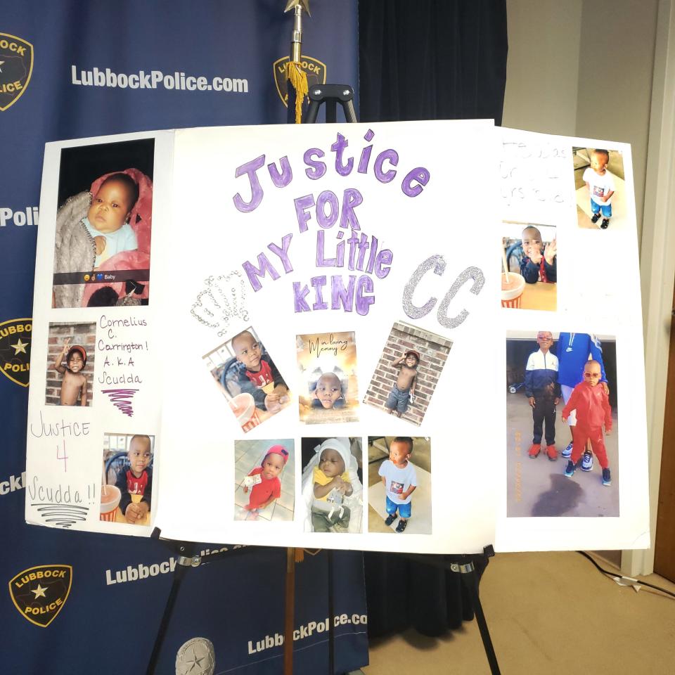 A poster filled with pictures of Cornelius Covington, 4, stands in the Lubbock police media room during a news conference where officials asked for help for information that could lead to the arrest of Covington's killers.