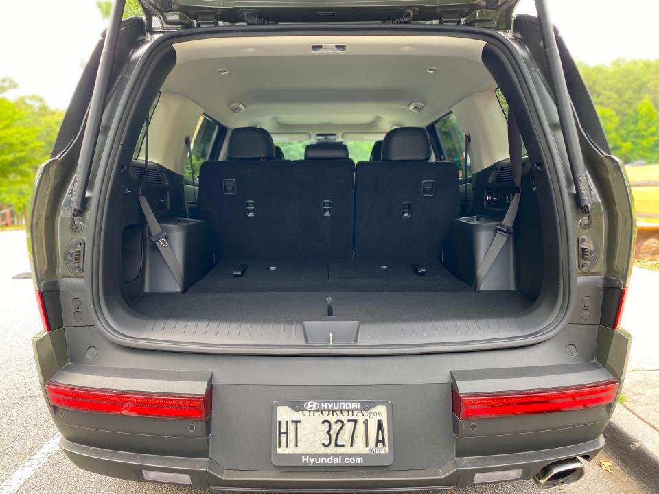 A green 2024 Hyundai Santa Fe XRT with its third-row seats folded.