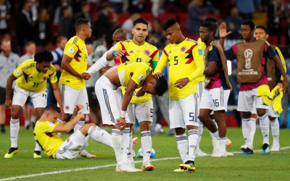 Colombia players react after losing a penalty shootout against England (EPA)