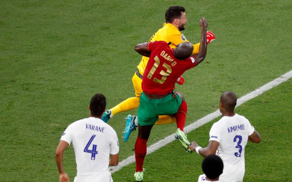 Portugal's Danilo Pereira is challenged by France's Hugo Lloris resulting in a penalty to Portugal - REUTERS/Laszlo Balogh