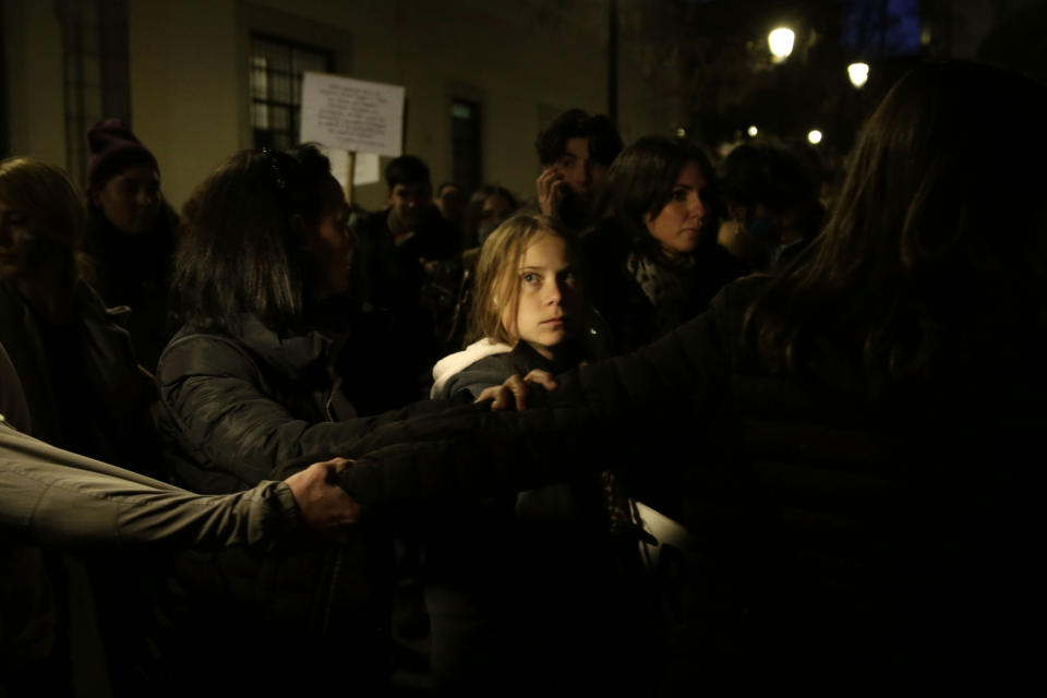 Climate activist Greta Thunberg arrives to take part in a protest in Madrid, Friday Dec. 6, 2019. Thunberg arrived in Madrid Friday to join thousands of other young people in a march to demand world leaders take real action against climate change. (AP Photo/Andrea Comas)