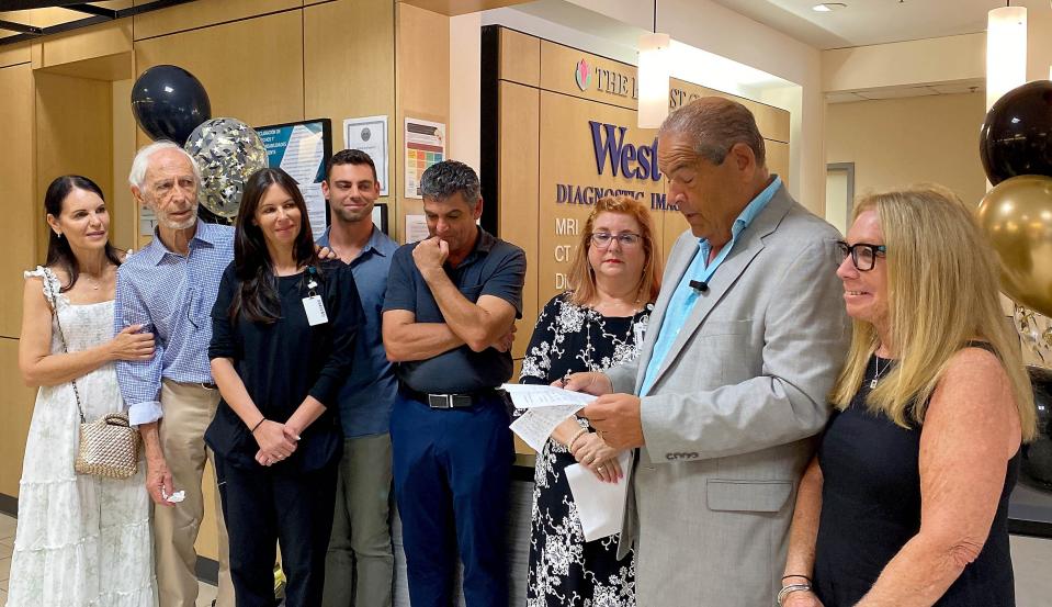 Jack Levine expresses his thanks to Hayley Ostrofsky (in black, at left) at West Boca Medical Center on Wednesday.