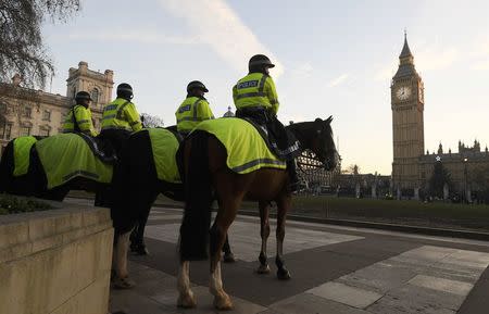 Mounted police stand on duty outside the Supreme Court opposite The Houses of Parliament in central London, Britain December 5, 2016. REUTERS/Toby Melville