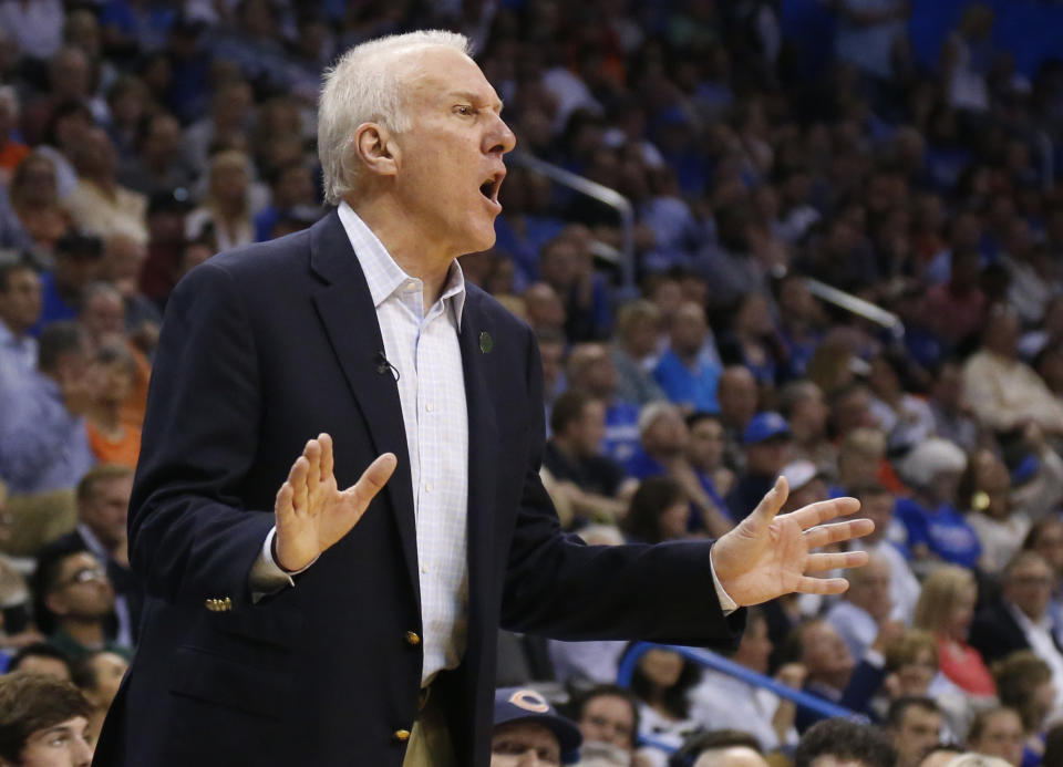 San Antonio coach Gregg Popovich shouts to his team in the third quarter of an NBA basketball game against the Oklahoma City Thunder in Oklahoma City, Thursday, April 3, 2014. Oklahoma City won 106-94. (AP Photo/Sue Ogrocki)