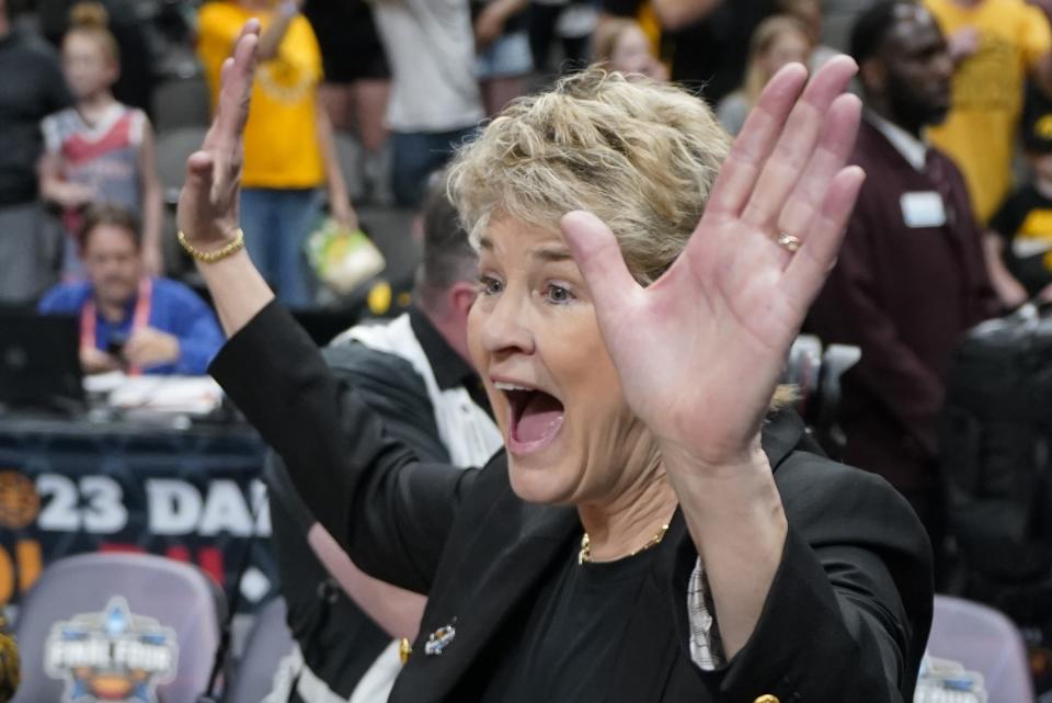 Iowa head coach Lisa Bluder celebrates after an NCAA Women's Final Four semifinals basketball game against South CarolinaFriday, March 31, 2023, in Dallas. Iowa won 77-73 to advance to the championship on Sunday. (AP Photo/Tony Gutierrez)