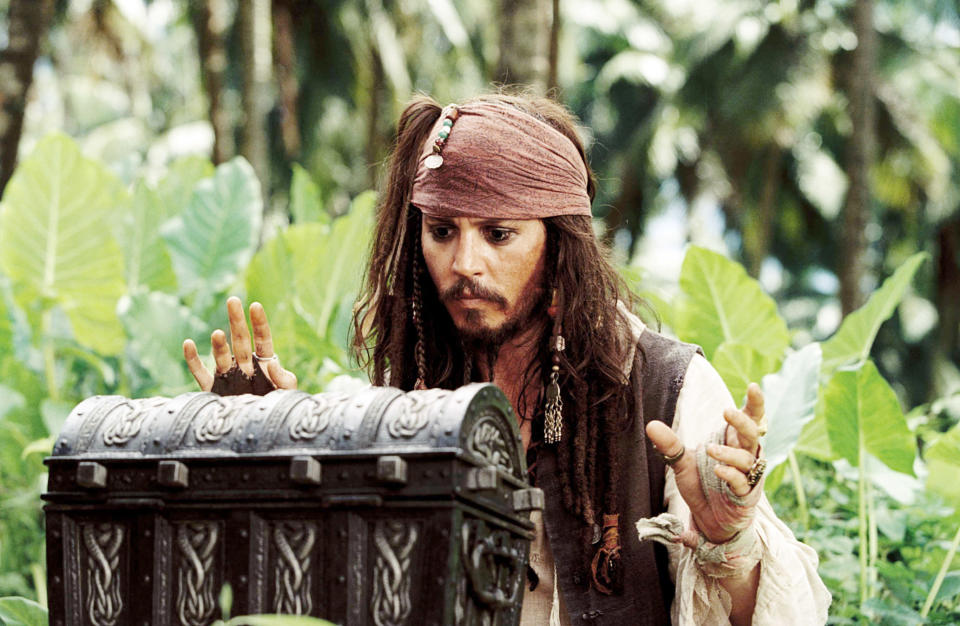 jack sparrow approaching a wooden chest