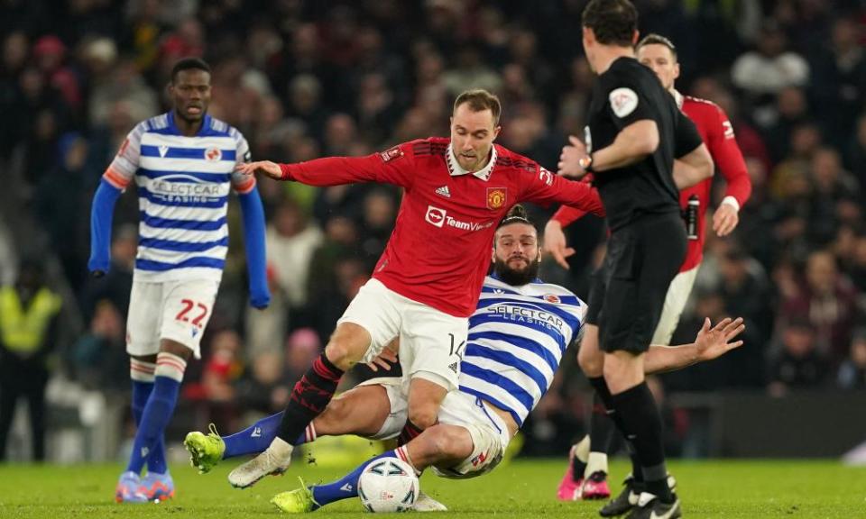 Christian Eriksen is fouled by Reading’s Andy Carroll against Reading.