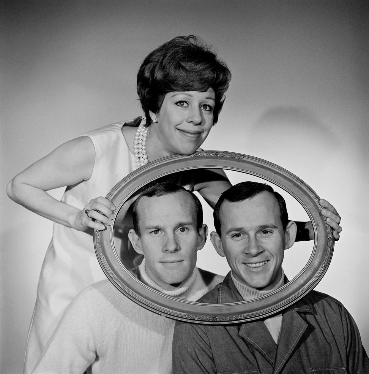 Carol Burnett with Tom and Dick Smothers (CBS via Getty Images)