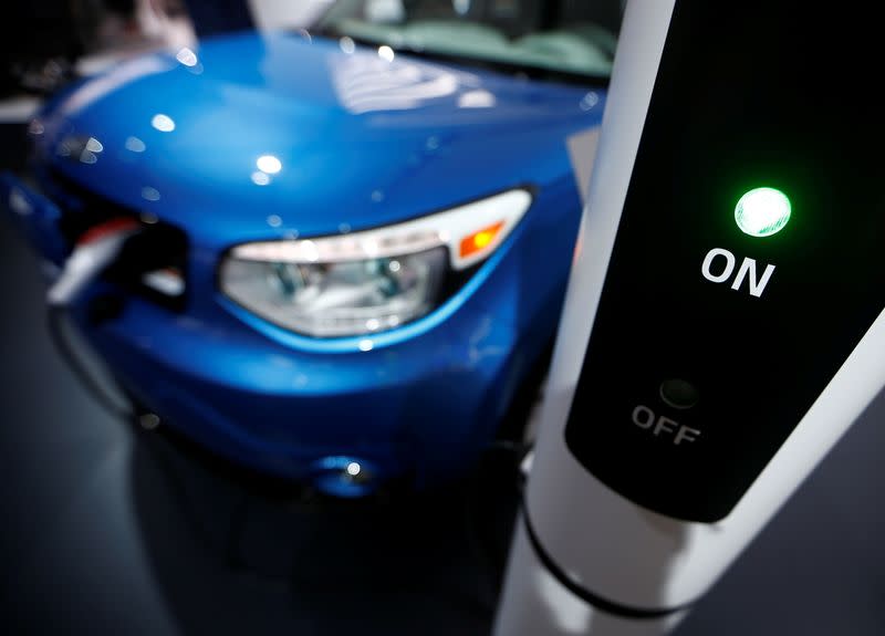 FILE PHOTO: A Kia Soul EV is plugged into a charging station during the second press day of the North American International Auto Show in Detroit