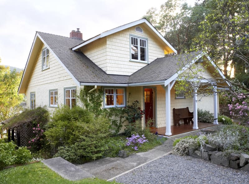 Exterior of cottage style house with front yard