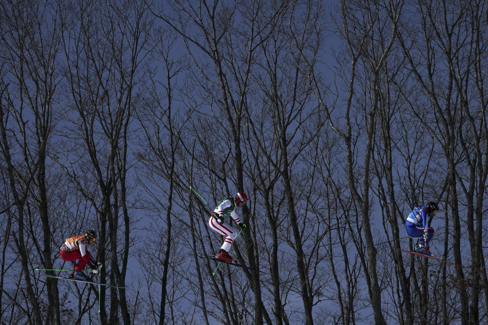 <p>From left, Russian athlete Semen Denshchikov, Robert Winkler, of Austria, and Arnaud Bovolenta, of France, run the course during the men’s ski cross quarterfinal at Phoenix Snow Park at the 2018 Winter Olympics in Pyeongchang, South Korea, Wednesday, Feb. 21, 2018. (AP Photo/Felipe Dana) </p>