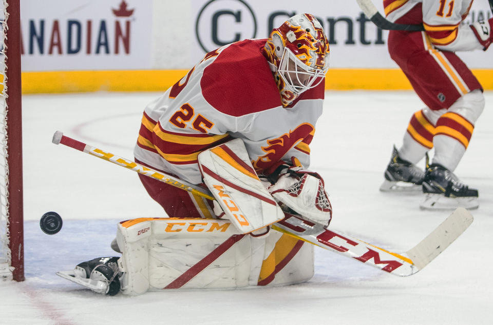 Calgary Flames' goalie Jacob Markstrom (25) makes the save against the Edmonton Oilers during the second period of an NHL hockey game, Thursday, April 29, 2021 in Edmonton, Alberta. (Jason Franson/Canadian Press via AP)